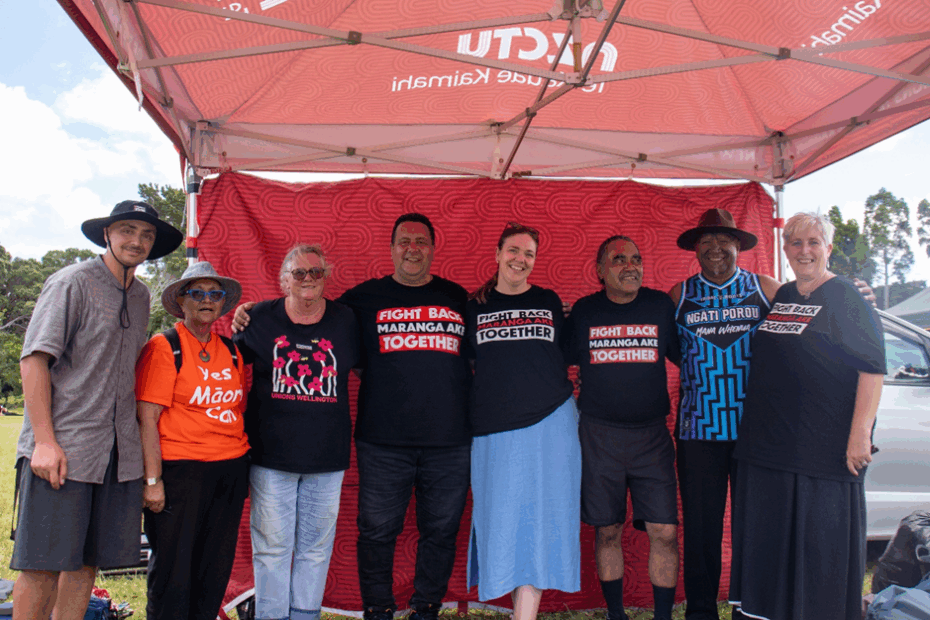Members of the NZCTU Te Kauae Kaimahi Rūnanga and leadership standing at the CTU tent at Waitangi