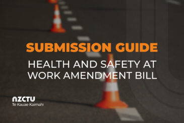 Text over a photo of road cones. Text reads: Submission Guide Health and Safety at Work Amendment Bill