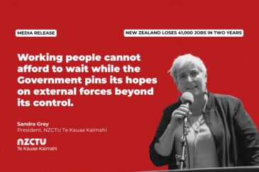 A media release graphic from NZCTU Te Kauae Kaimahi on a bold red background. A banner reads "NEW ZEALAND LOSES 41,000 JOBS IN TWO YEARS." The main headline states: "Working people cannot afford to wait while the Government pins its hopes on external forces beyond its control," attributed to Sandra Grey, President, NZCTU Te Kauae Kaimahi. On the right, a black-and-white photo shows a woman with short white hair speaking into a microphone at a podium.