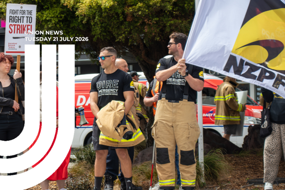 Firefighters in tan uniform pants and black 'Dire Emergency' t-shirts stand at a roadside protest, one holding a large NZPFU flag, and more demonstrators in the background. Overlaid text reads 'Union News, Tuesday 21 July 2026'.