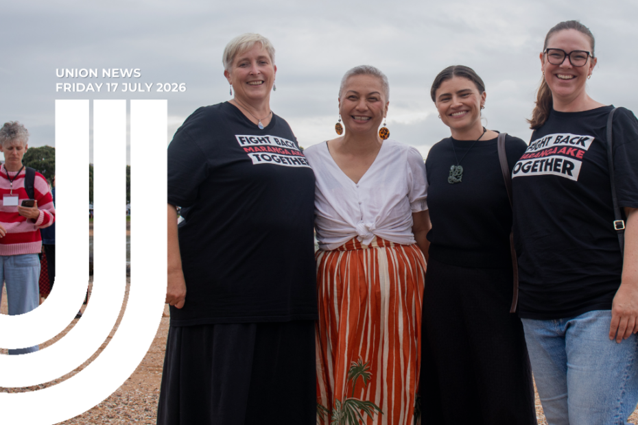 Four women smiling pictured, from left: Sandra Grey, Marama Davidson, Chloe Swarbrick, Melissa Ansell-Bridges. Sandra and Melissa are in black Fight Back Together Maranga Ake t-shirts, Chloe is in all black and marama is in a white top and a stripped orange skirt. The sky behind them is grey with clouds.