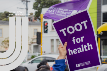 A hand holding up a purple placard reading "Toot for health" with the New Zealand Nurses Organisation logo. A purple NZNO flag flies behind them, with a traffic lights, and a white car in the background. Text overlay reads "Union News, Friday 3 July 2026"