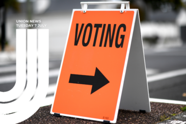 An orange sandwich board sign reading "VOTING" in black capital letters with a large black arrow pointing right, Overlaid text reads "Union News, Tuesday 7 July" with a white union logo on the left.