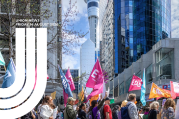 Union members marching in central Auckland with union flags, Sky Tower behind. Text overlay: "Union News – Friday 14 August 2026".