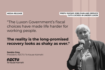Graphic with a dusty pink background for NZCTU media release: PREFU shows jobs pain and service cuts locked in under Luxon. Quote: "The Luxon Government's fiscal choices have made life harder for working people. The reality is the long-promised recovery looks as shaky as ever." – Sandra Grey, President, NZCTU. Black-and-white photo of Sandra Grey speaking into a microphone on a stand, wearing a dark open jacket over a light top.